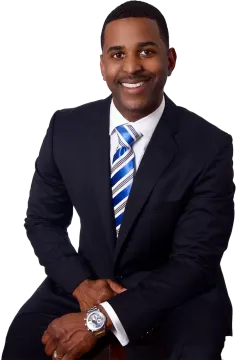 a man in a suit and tie posing for a picture