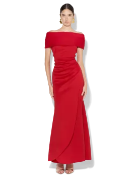 a woman wearing a red off the shoulder dress