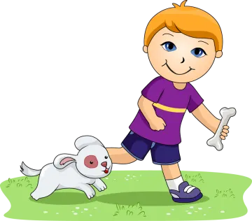 a boy playing with his dog on the grass