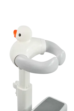 a white bird sitting on top of a sink