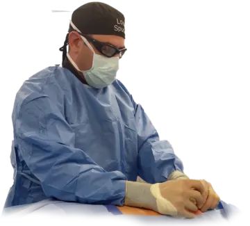 a man wearing a surgical mask and gloves