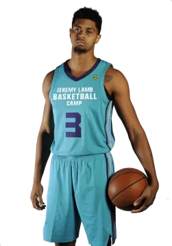 a man in a blue uniform holding a basketball ball