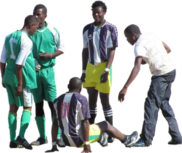 a group of men playing soccer together