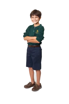 a young boy standing with his arms crossed