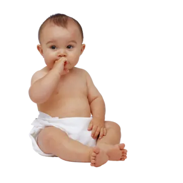a baby sitting on the floor with his finger in his mouth