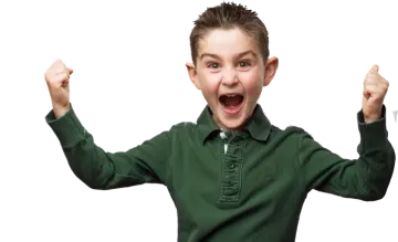 a young boy with his arms in the air