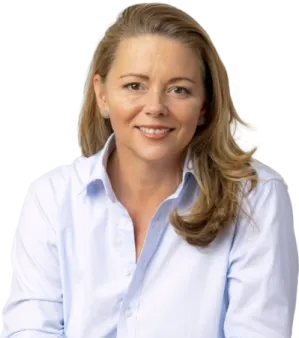 a woman in a blue shirt smiles at the camera