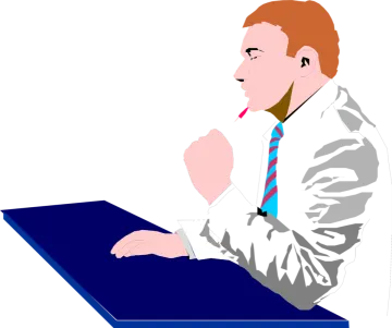 a man in a suit and tie sitting at a table