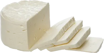 a piece of cheese is cut into pieces