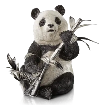 a stuffed panda bear holding a bamboo stick