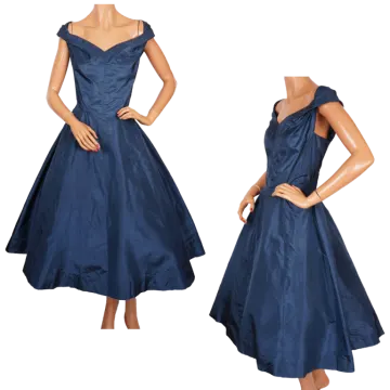 a woman wearing a dark blue dress