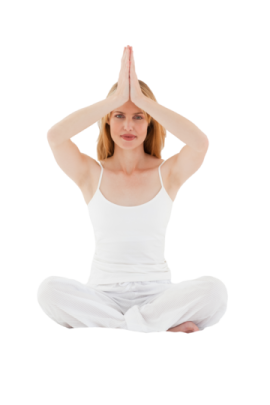 a woman sitting in the middle of a yoga pose