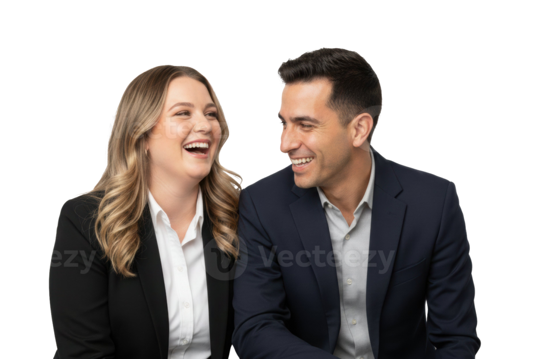 a man and woman sitting at a table laughing