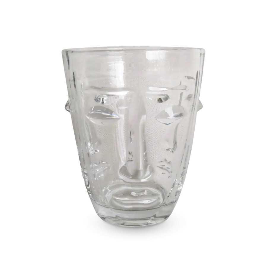 a glass cup with a face on it