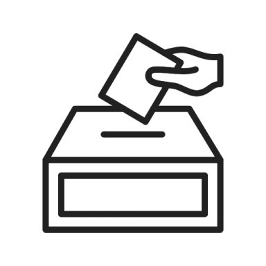 a hand putting a voting paper into a ballot box