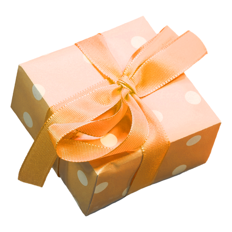 a gift box with a gold bow and polka dots