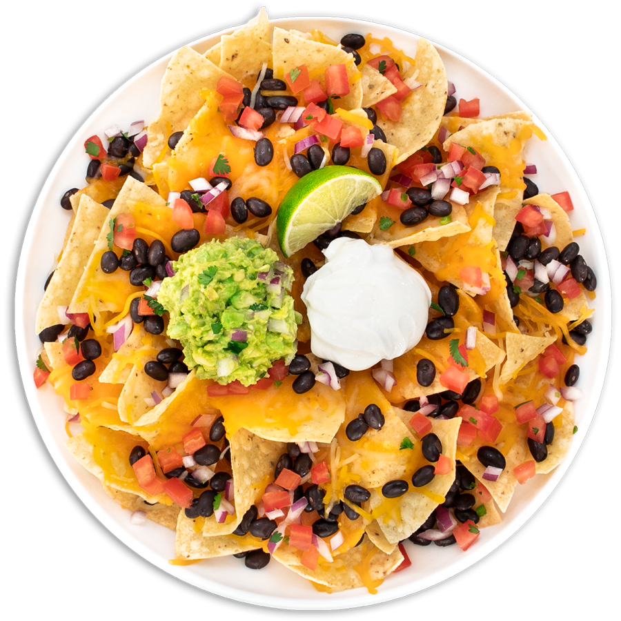 a white plate topped with black beans, cheese, tomatoes, and gule