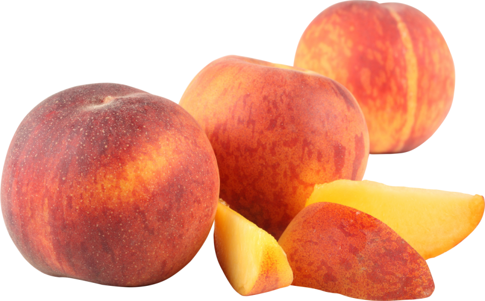 a pile of sliced peaches on a white background