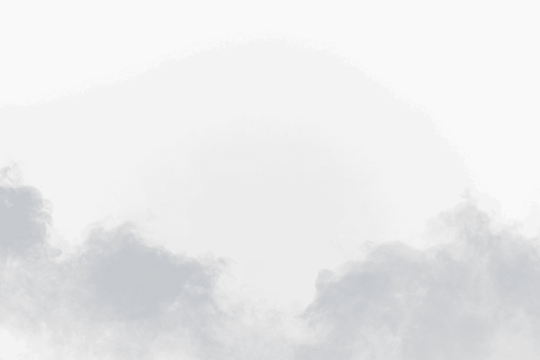 a plane flying through the clouds in the sky