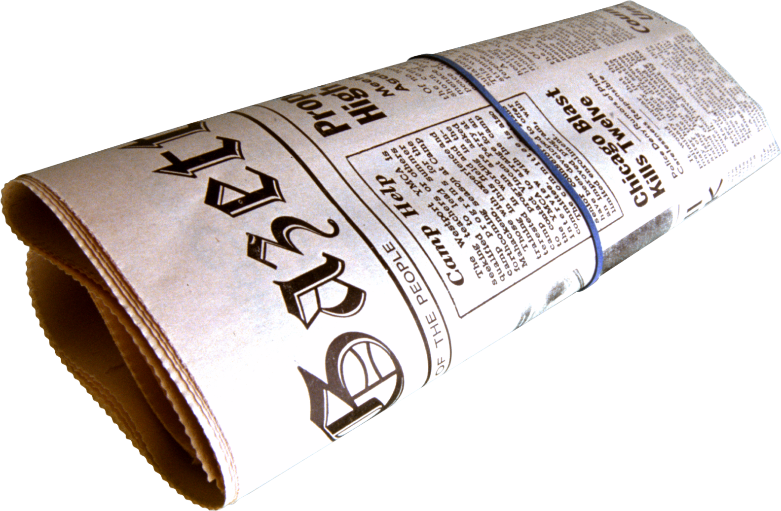 a roll of newspaper sitting on a white surface