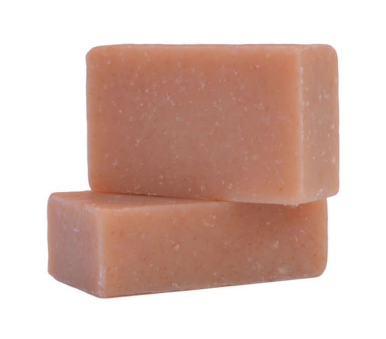 a block of orange soap on a white background