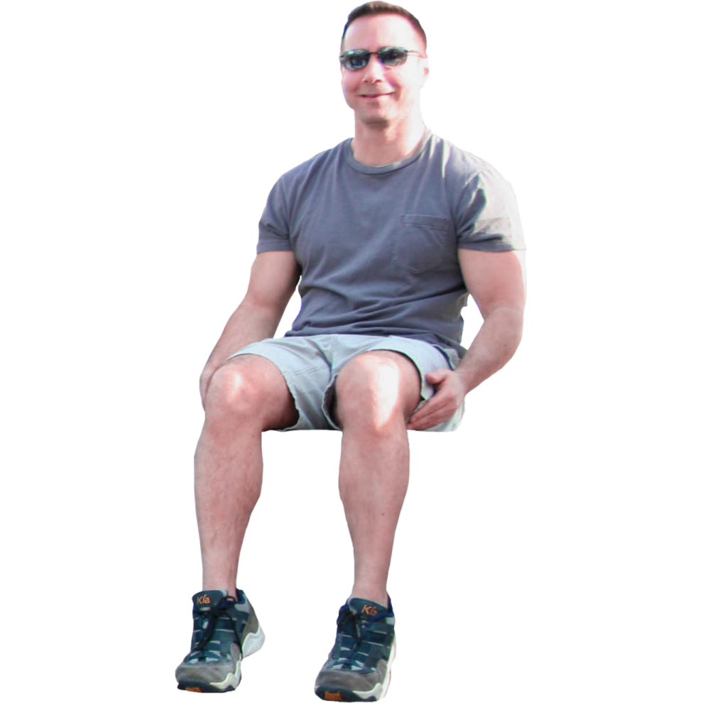 a man sitting on a stool with his legs crossed
