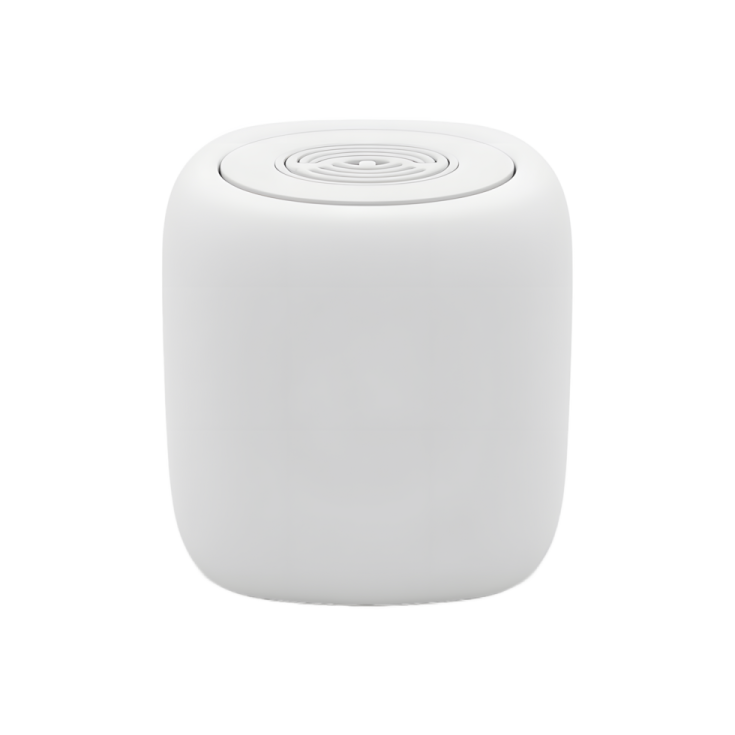 a white speaker sitting on top of a table