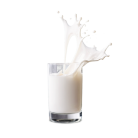 a glass filled with milk and splashing