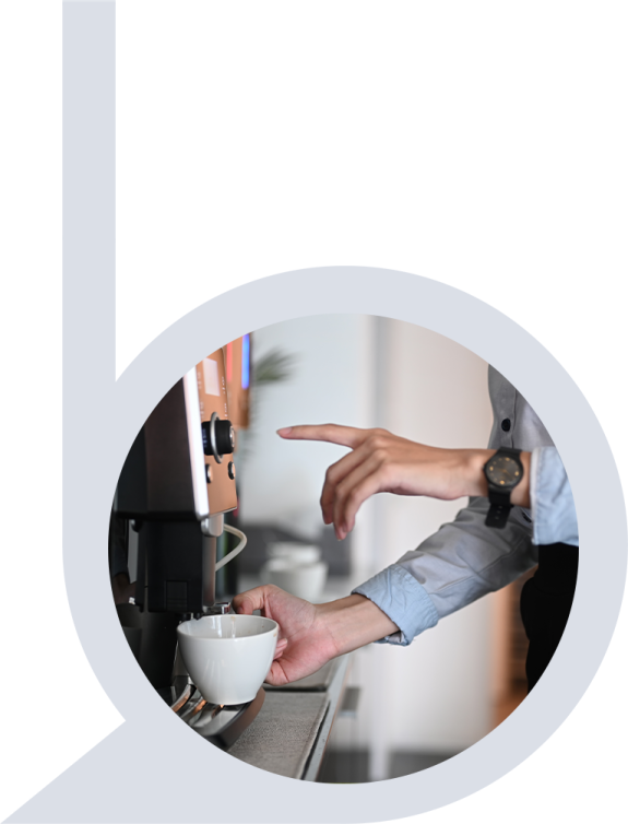 a person holding a coffee cup in their hand