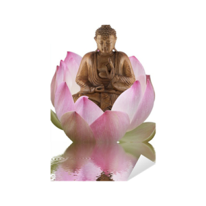 a buddha statue sitting on top of a pink flower