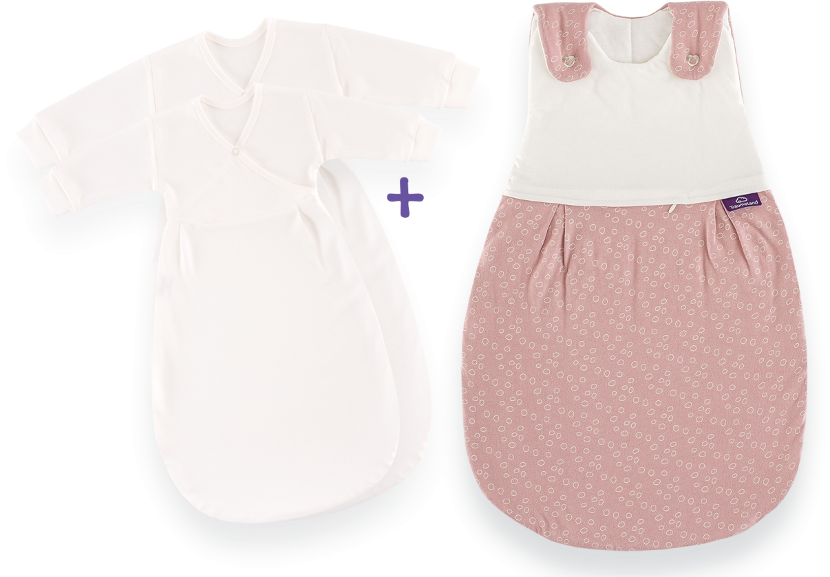 a white and pink baby gown next to an infant's bodysuit