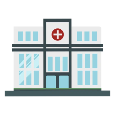 a hospital building with a red cross on the front