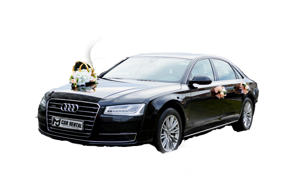 a black audi car with flowers on the hood