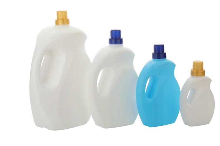 three plastic bottles with blue and white liquids