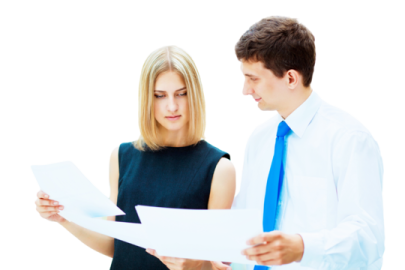 a man and woman are looking at papers