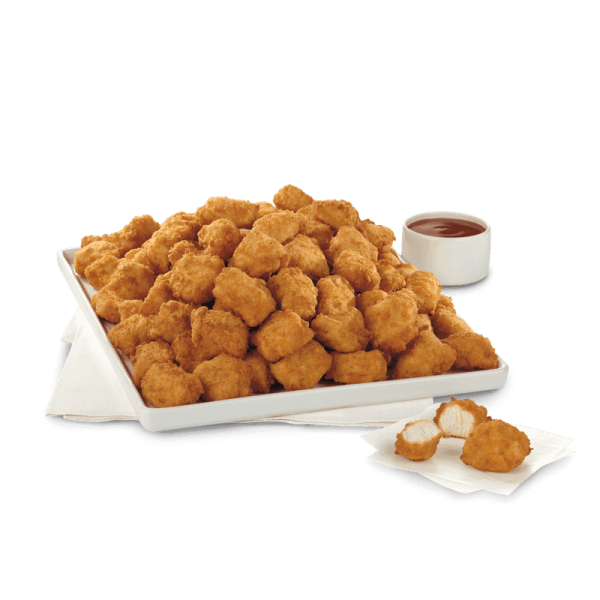 a plate of fried food next to a cup of sauce