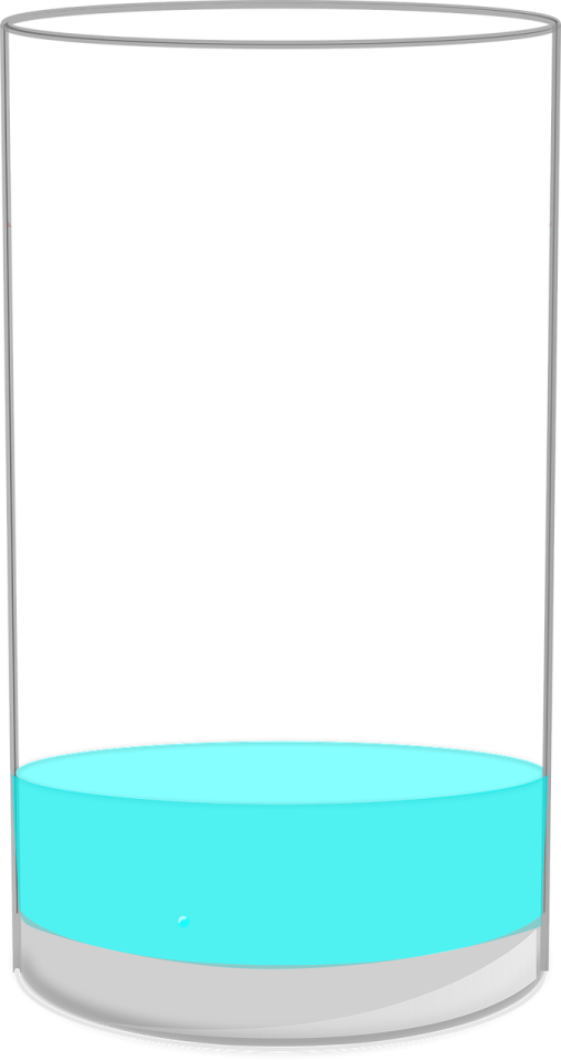 a glass filled with water on a white background