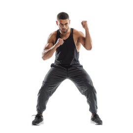 a man in a black tank top and grey pants