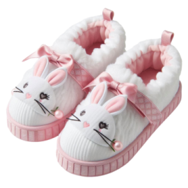 a pair of white and pink baby shoes with bunny ears