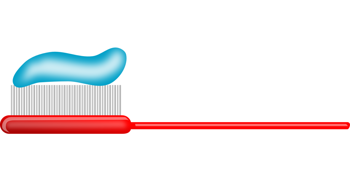 a tooth and toothbrush on a white background
