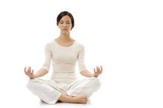a woman sitting in the middle of a yoga pose
