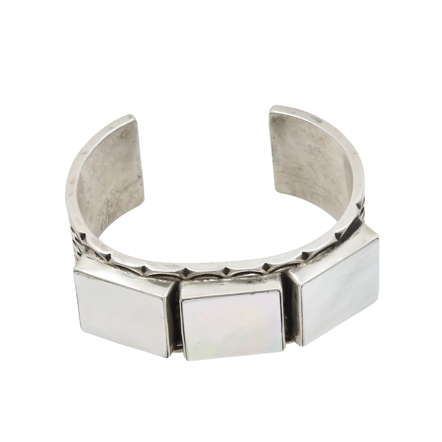 a silver cuff bracelet with a square design