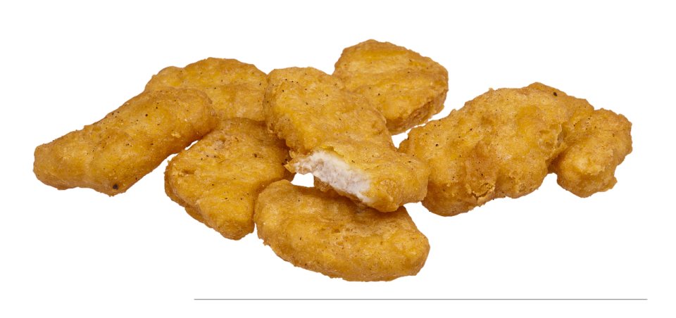 a pile of chicken nus on a white background