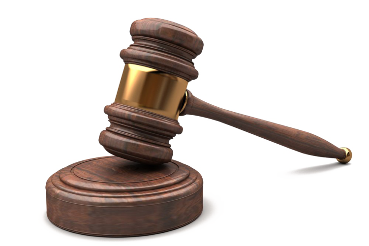 a wooden judge's gaven on a white background