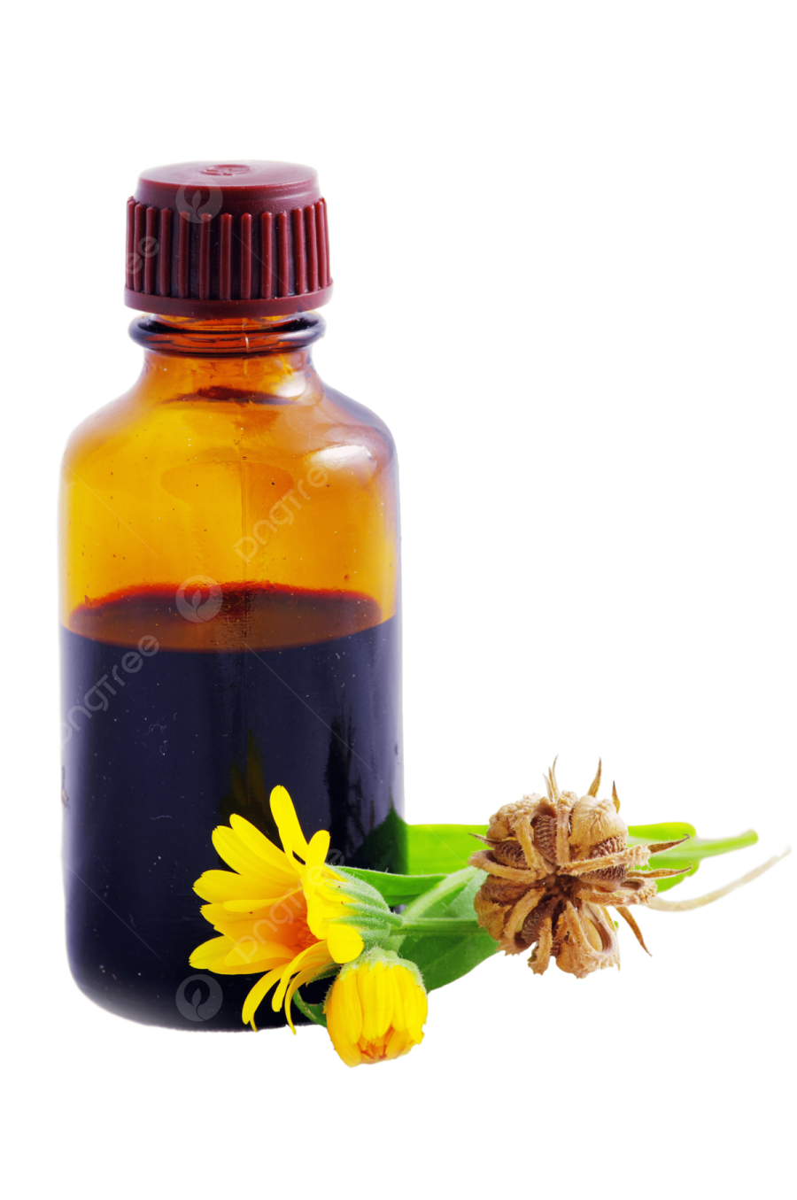 a bottle filled with liquid next to a flower