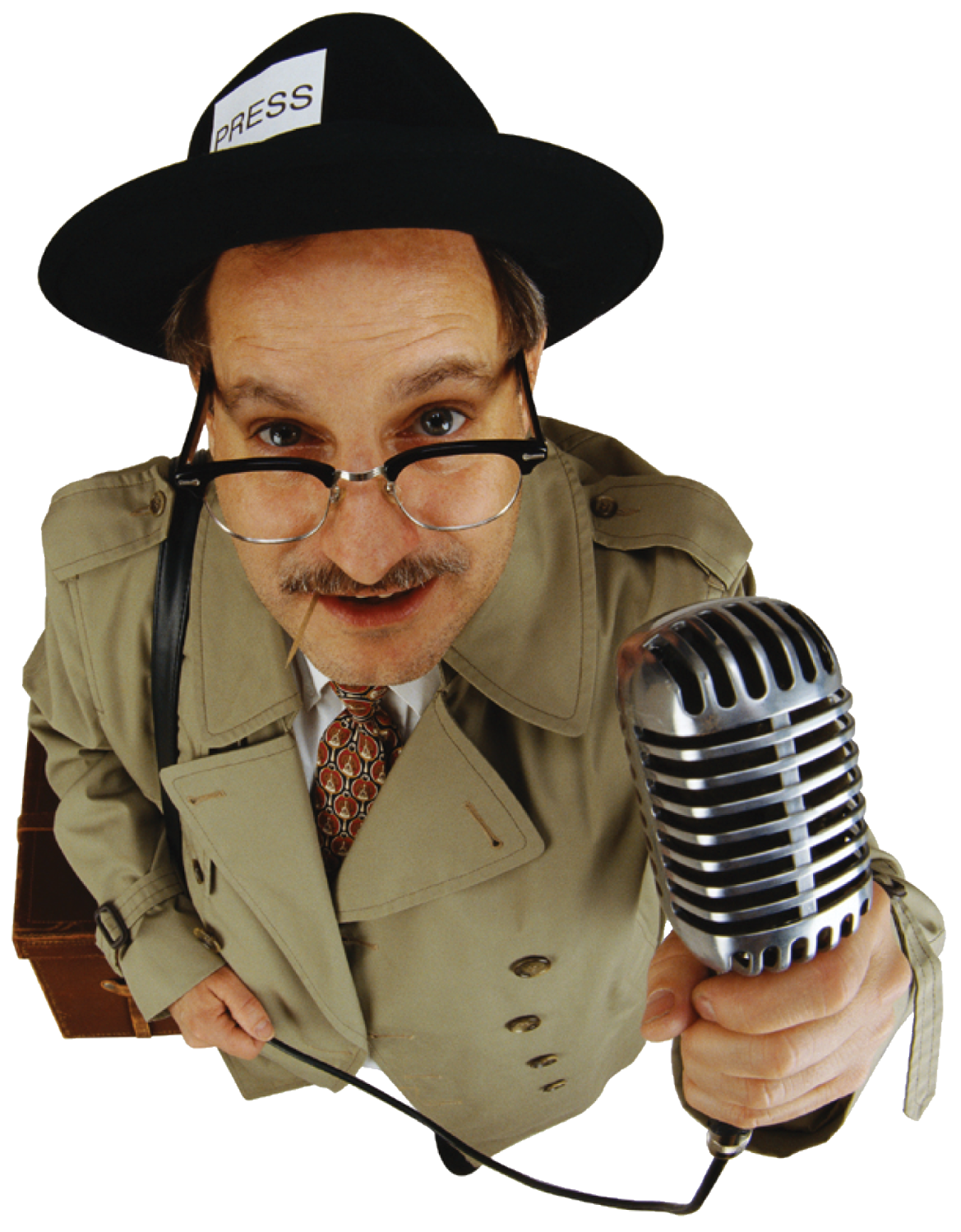 a man wearing a hat and holding a microphone