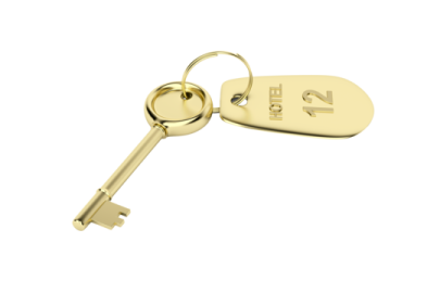 a gold key on a white background