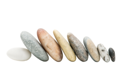 a row of pebbles on a white background
