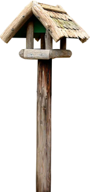 a bird house on top of a wooden pole