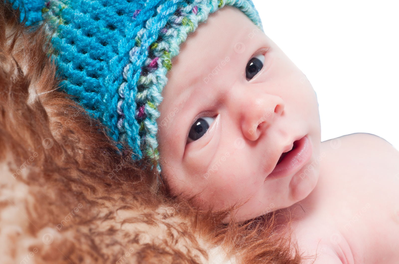 a close up of a baby wearing a hat